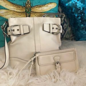 Coach white leather handbag and wristlet set.